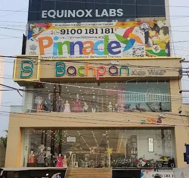 Building and Pinnacle signage at Chanda Nagar.