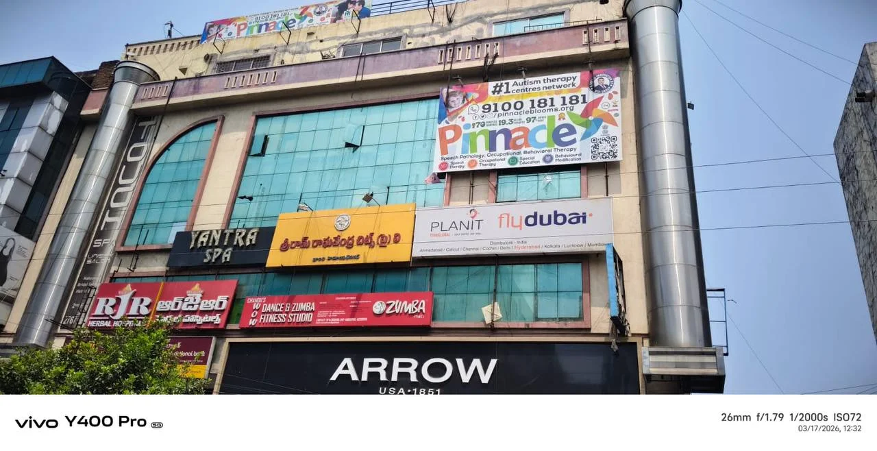 Building and Pinnacle signage at Himayat Nagar.