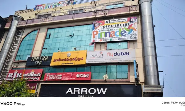 Building and Pinnacle signage at Himayat Nagar.
