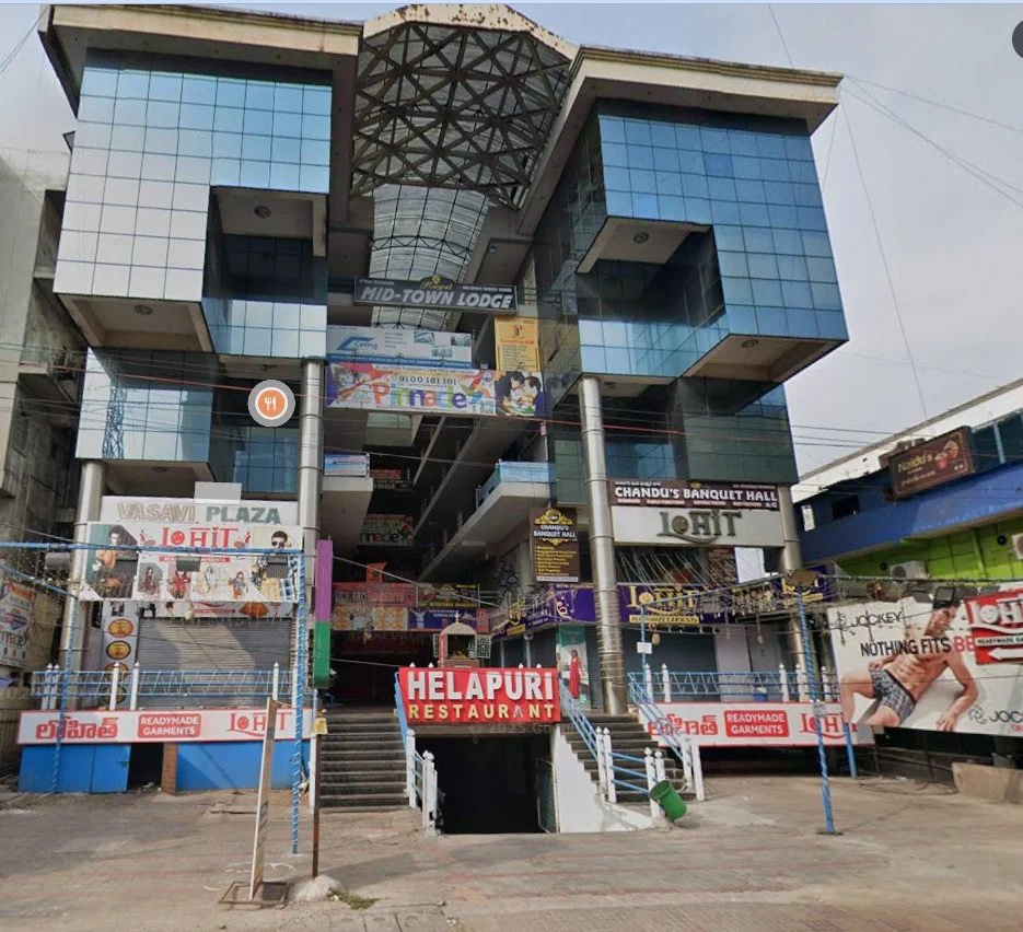 Building and Pinnacle signage at Jagadamba, Visakhapatnam.