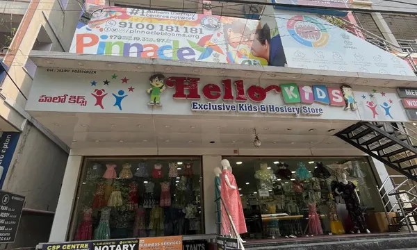 Building and Pinnacle signage at Pragathi Nagar.