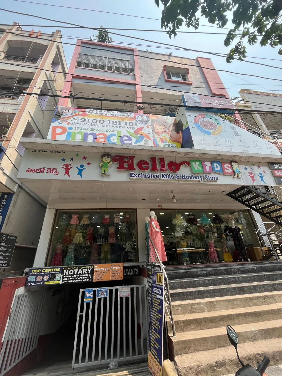 Building and Pinnacle signage at Pragathi Nagar.