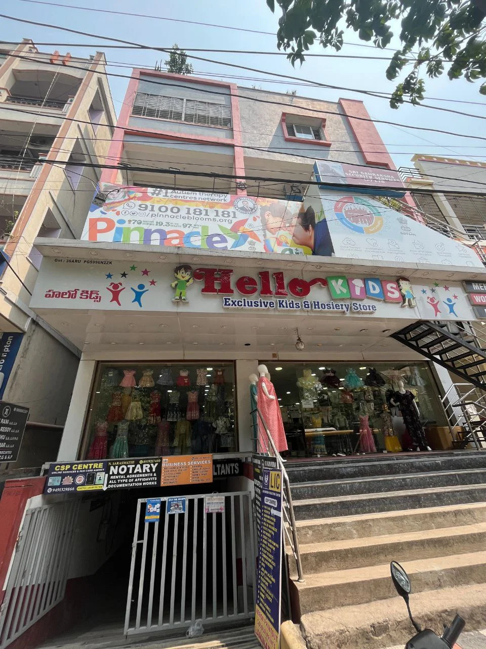 Building and Pinnacle signage at Pragathi Nagar.