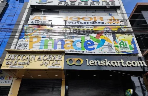 Building and Pinnacle signage at Santosh Nagar.