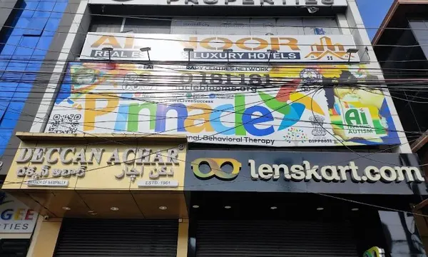 Building and Pinnacle signage at Santosh Nagar.