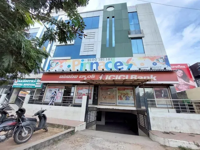 Building and Pinnacle signage at SR Nagar.